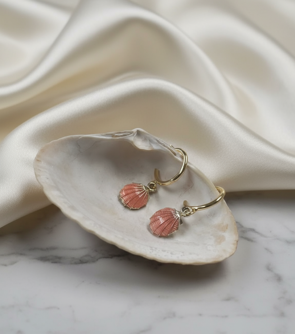 Gold Shell Charm Earrings with Elegant Background